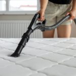 Vacuuming a mattress using the extension